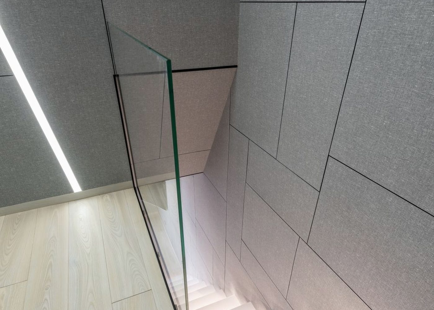 A stone and glass stair detail in a modern building