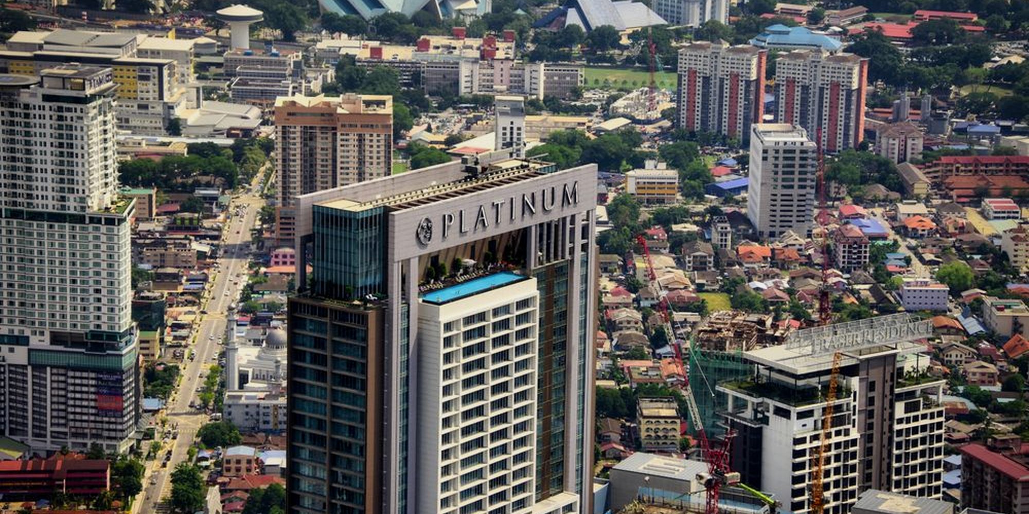 Aerial view over dense Kuala Lumpur high-rise housing
