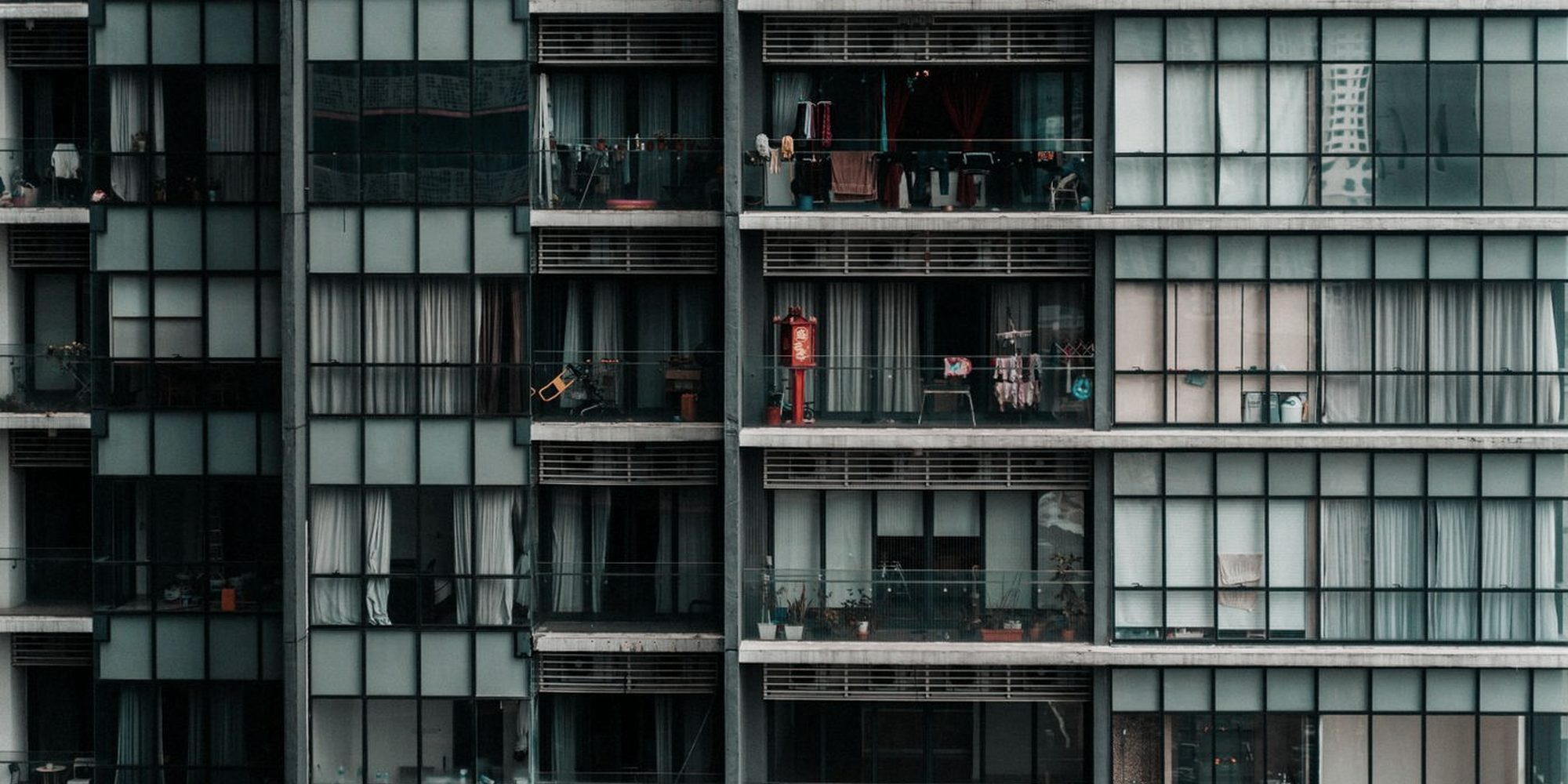 The glass and steel facade of a Kuala Lumpur apartment building