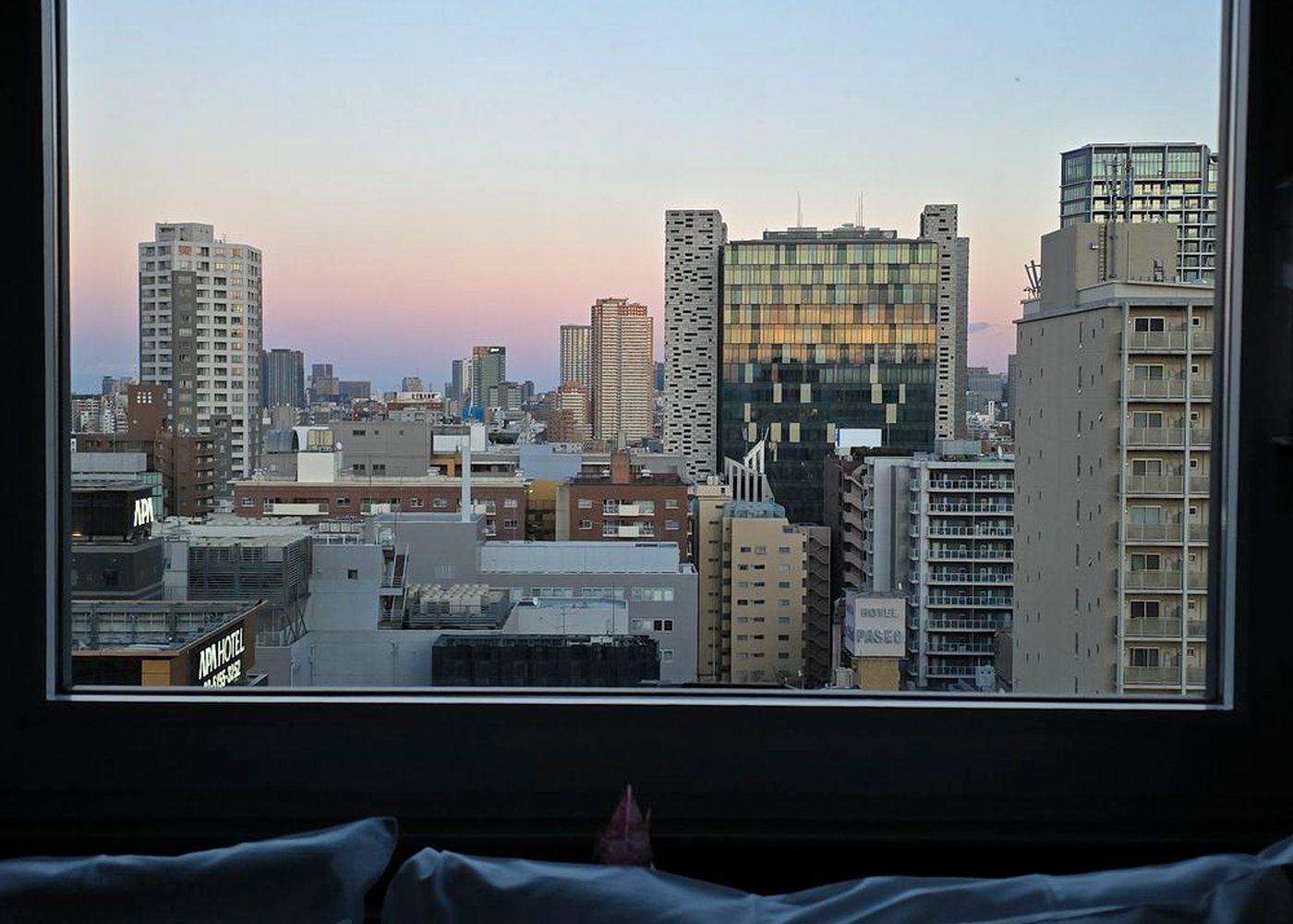 A city view from inside a high-rise apartment