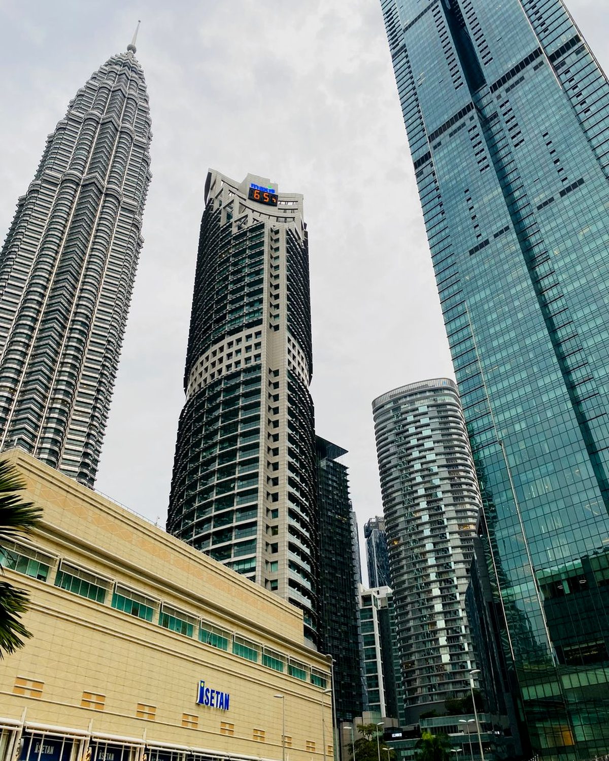 Two residential towers seen from street level